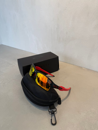 Lentes OAK negro y rojo 7203
